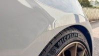 A dent sitting on a swage line, judged more strictly than the same size dent on a flat panel.
