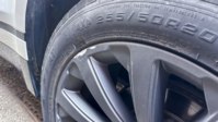 A kerbed alloy wheel; damage to the rim edge is judged more leniently than a mark on the spokes or fascia.