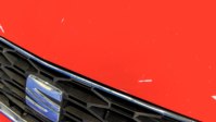 Stone chips along the bonnet leading edge, the kind ordinary driving collects over a lease term.