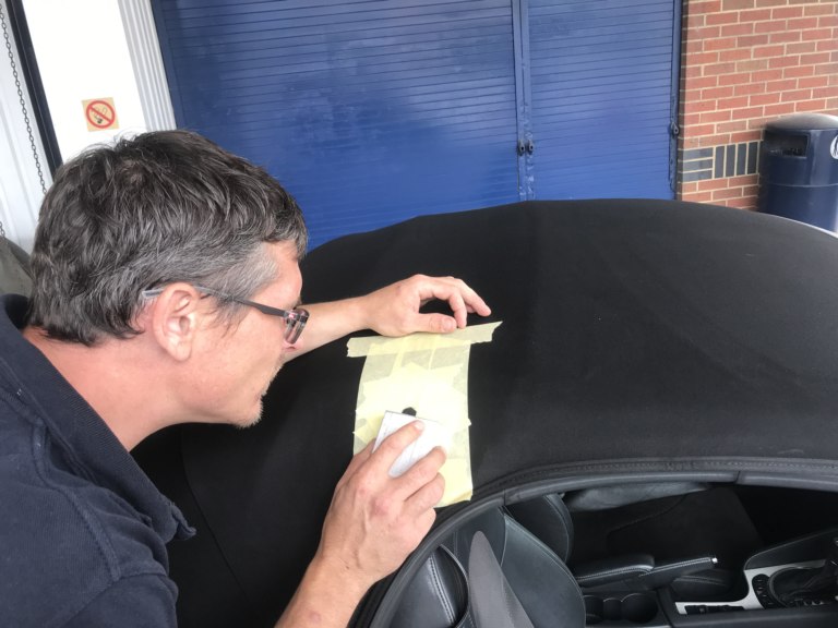 Repairing a tear in a convertible roof