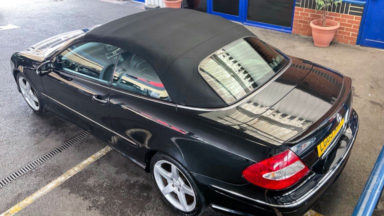 Convertible parked to dry out.