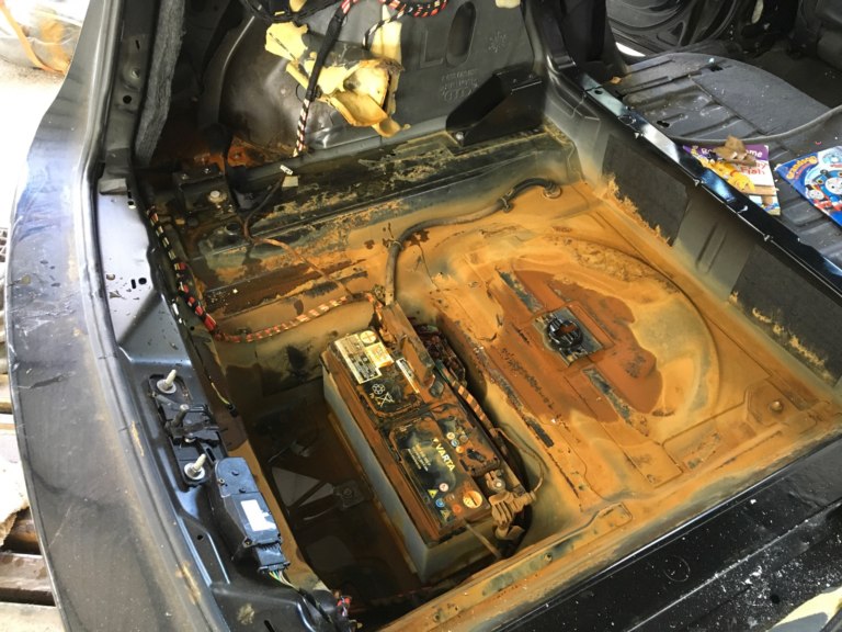 Rust in spare wheel compartment