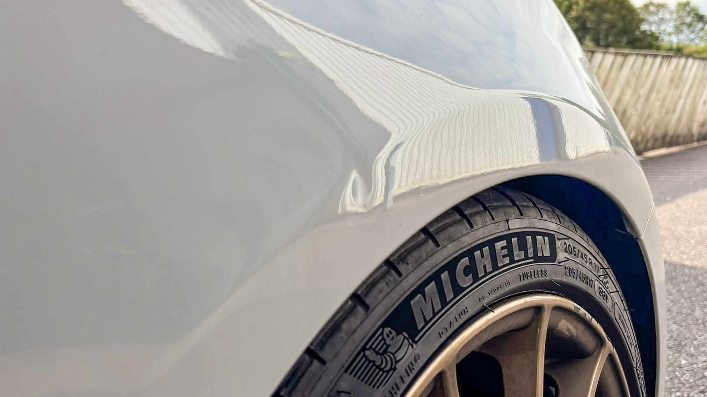 A dent sitting on a swage line, judged more strictly than the same size dent on a flat panel.