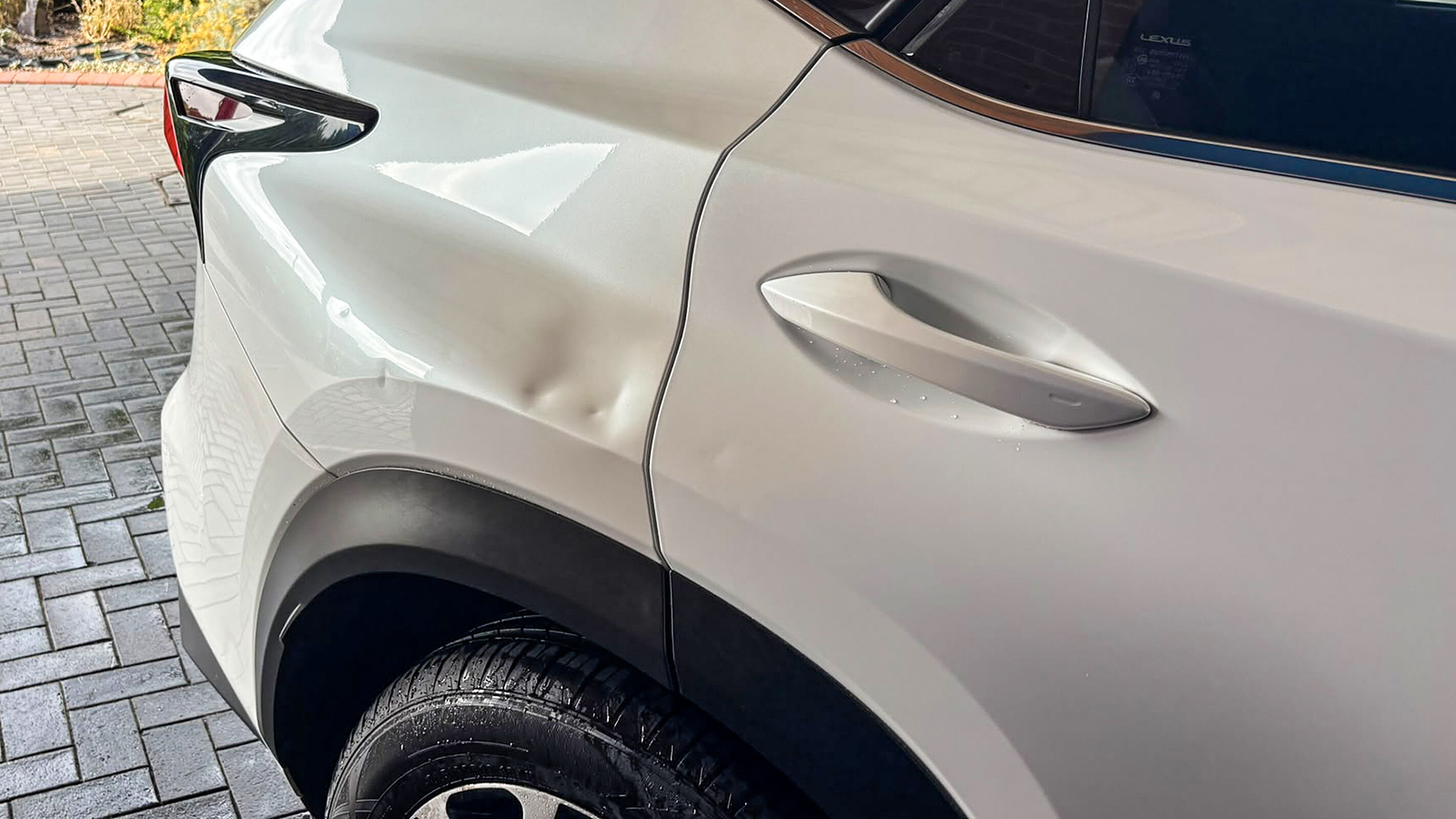 A dent beyond the usual 10 to 15mm range, on a door panel.