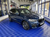 BMW X3 with 3-year ceramic coating Matrix Blue.