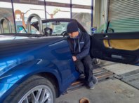James fixing a water leak on an Audi.