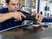 Alfie using a machine polisher for paintwork correction.