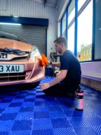 Tom hand finishing a paintwork correction.