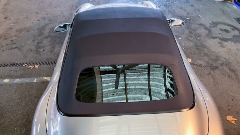 Porsche convertible roof after cleaning and with waterproof protection.